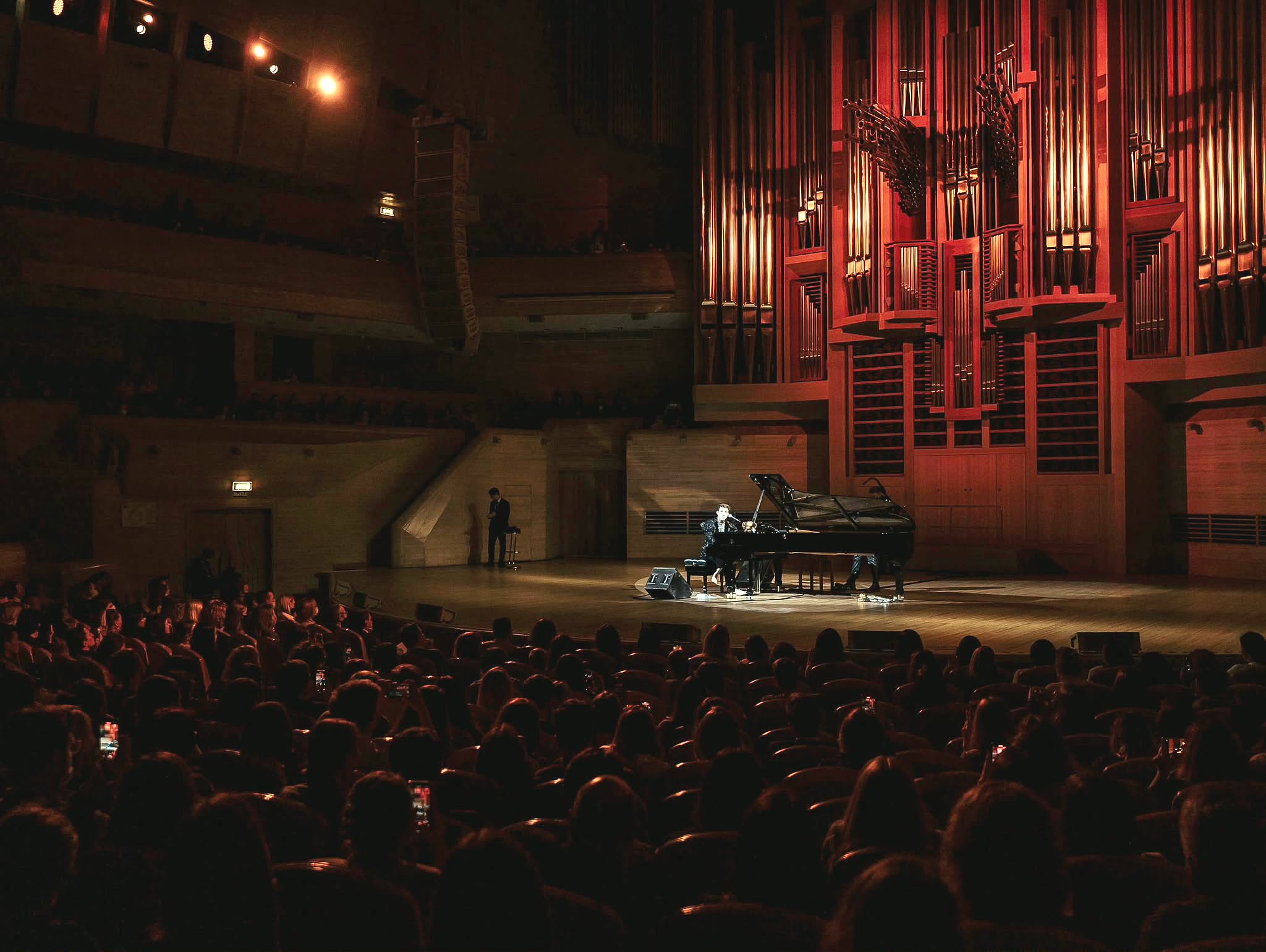 Stephen Ridley performing on a concert stage